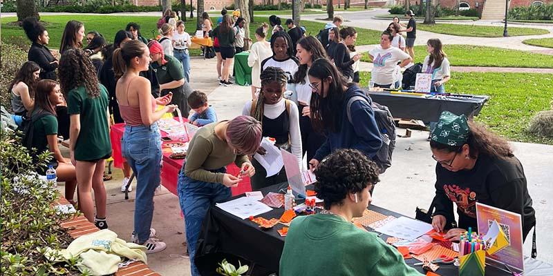 students exploring organizations on campus on tableling event